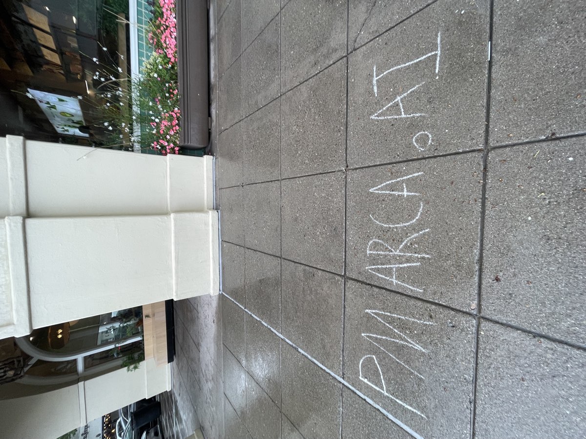 PMARCA.AI chalked outside Rosewood Sand Hill hotel